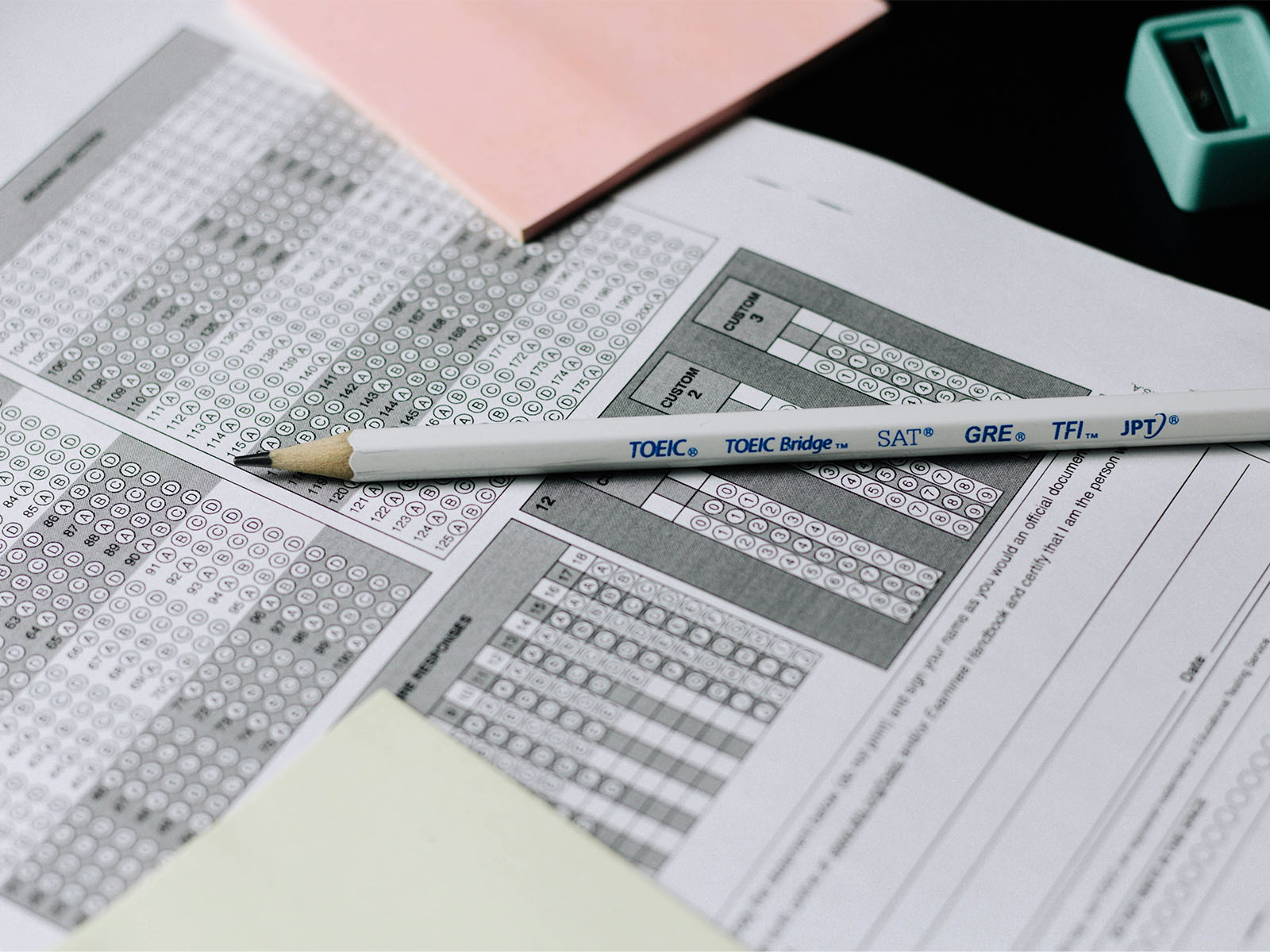 Warren UC - International Private College Counselling - Navigating the SAT- A Practical Guide for High School Students and Parents - SAT bubble test paper with pencil - Unsplash Nguyen Dang Hoang Nhu